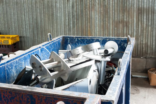 Mitallic container full of industrial iron waste products.