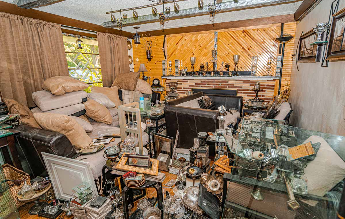 Living room in a hoarder's home full of junk